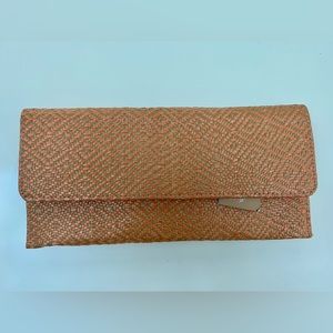 NWT Beautiful straw clutch with Orange accents.   Francesca’s.